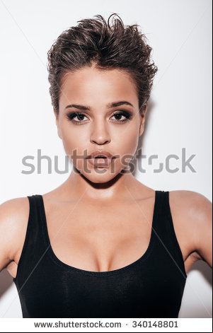 stock photo gorgeous beauty beautiful young short hair woman in black tank top looking at camera while